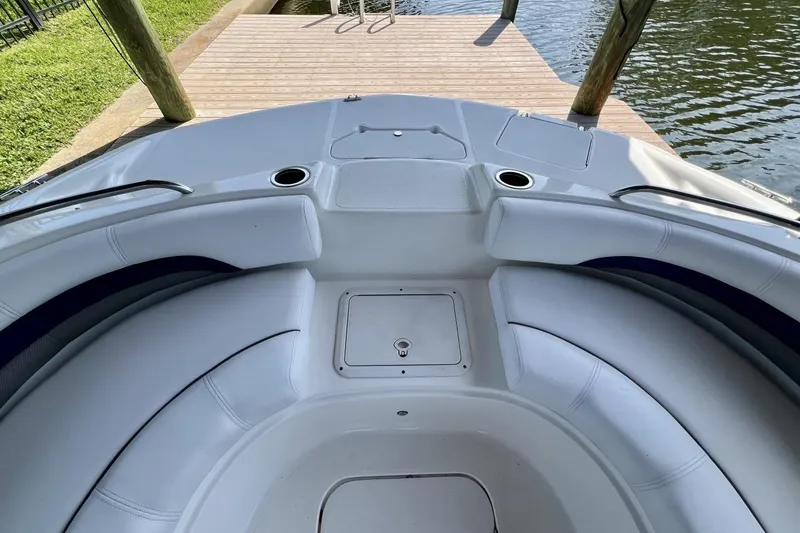 Slide: The Image of 2013 Hurricane SunDeck 187 OB boat interior with white seating and cup holders. - 35