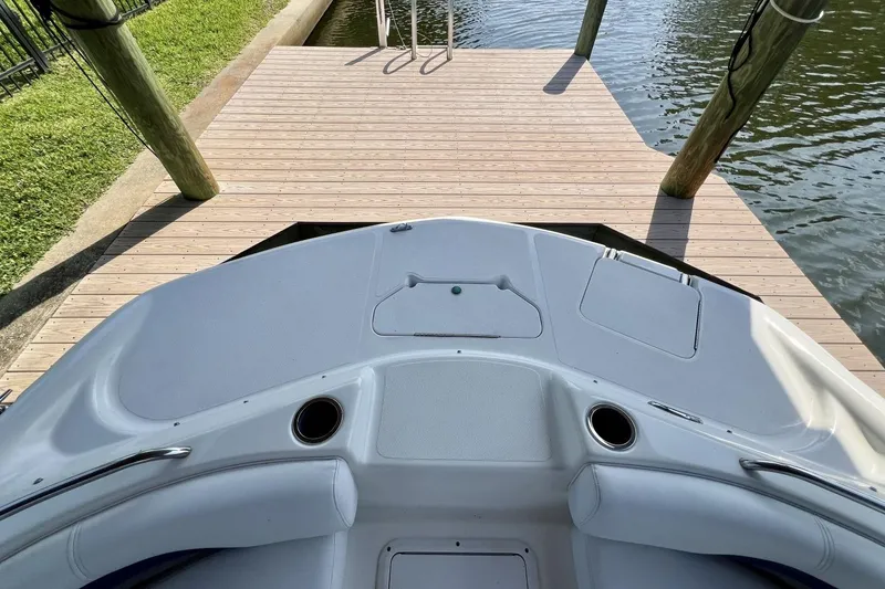 Slide: The Image of 2013 Hurricane SunDeck 187 OB boat docked by wooden pier. - 37