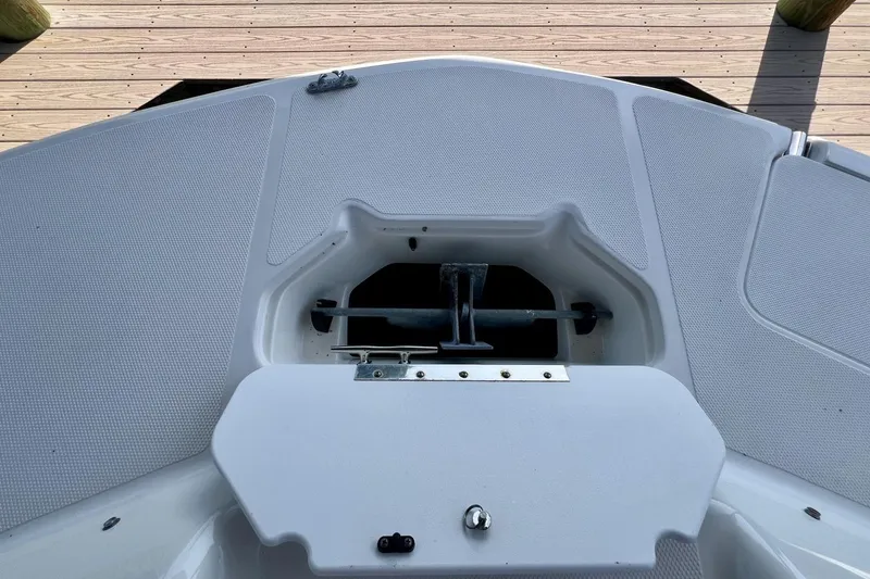 Slide: The Image of 2013 Hurricane SunDeck 187 OB boat anchor compartment on deck. - 38