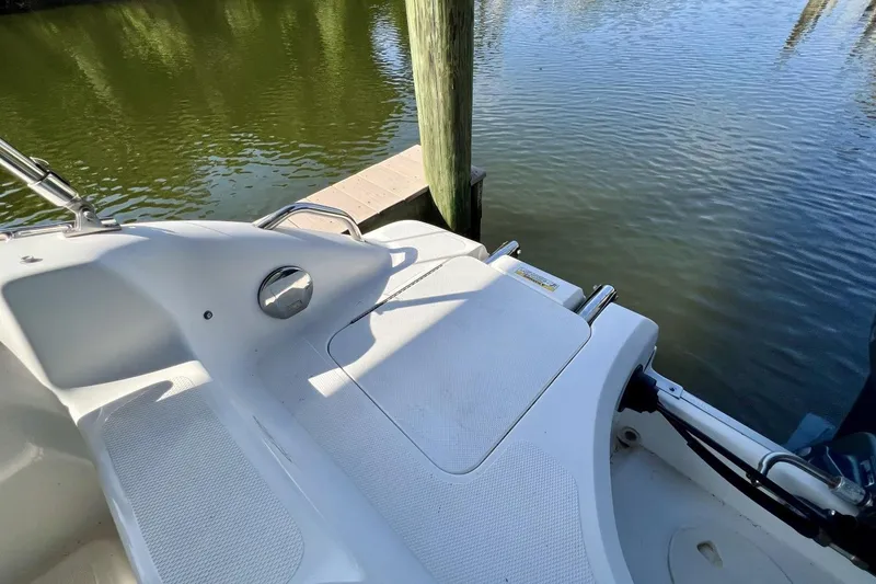 Slide: The Image of 2013 Hurricane SunDeck 187 OB boat deck by calm water. - 42