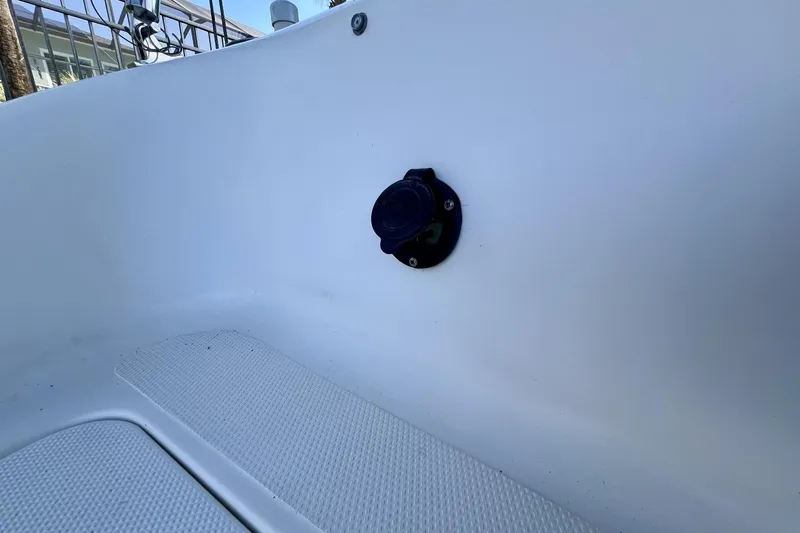 Slide: The Image of 2013 Hurricane SunDeck 187 OB interior detail with a black fixture on white surface. - 46