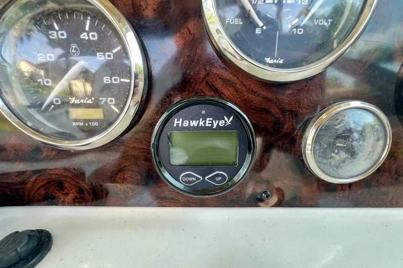 Slide: The Image of Dashboard of a 2013 Hurricane SunDeck 187 OB with gauges and Hawkeye display. - 47