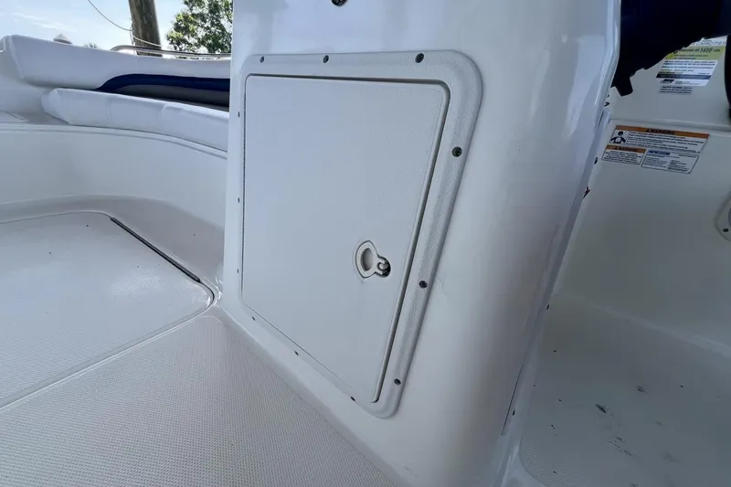 Slide: The Image of 2013 Hurricane SunDeck 187 OB boat interior with storage compartment and seating. - 53