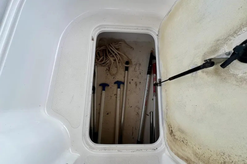 Slide: The Image of Storage compartment of 2013 Hurricane SunDeck 187 OB with ropes and poles. - 60
