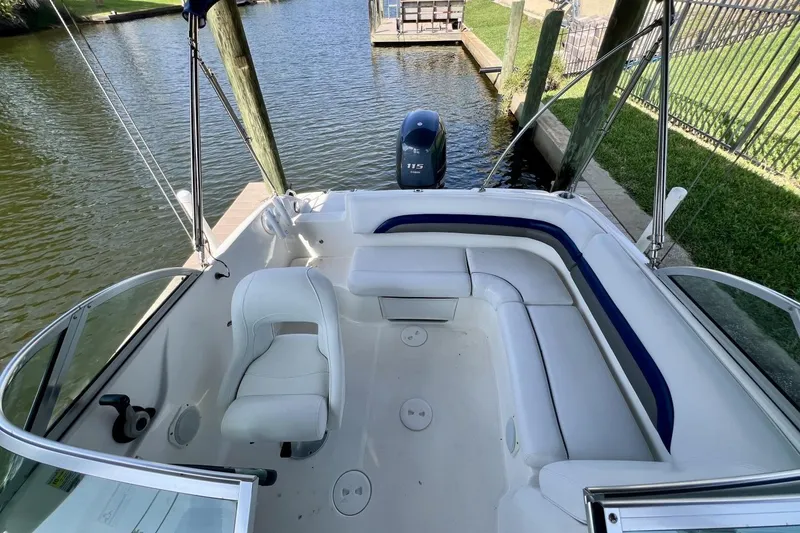 Slide: The Image of 2013 Hurricane SunDeck 187 OB boat interior with seating and outboard motor. - 63