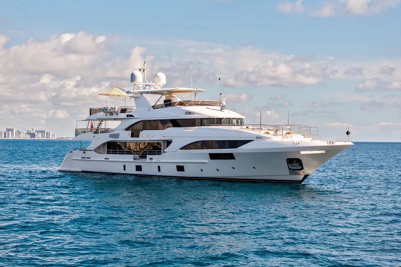 The Image of Luxurious 2012 Benetti Classic Supreme 132 yacht cruising on open sea under blue sky. - 0
