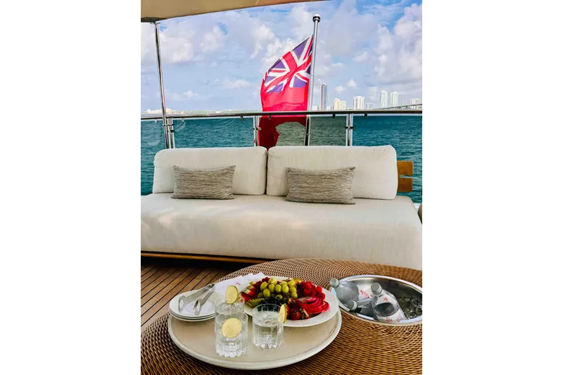 Slide: The Image of Luxurious Benetti Classic Supreme 132 yacht deck with elegant seating and refreshments, 2012 model. - 13