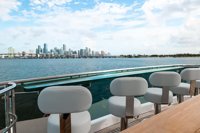 Slide: The Image of Luxury yacht Benetti Classic Supreme 132, 2012, with city skyline view over water. - 18