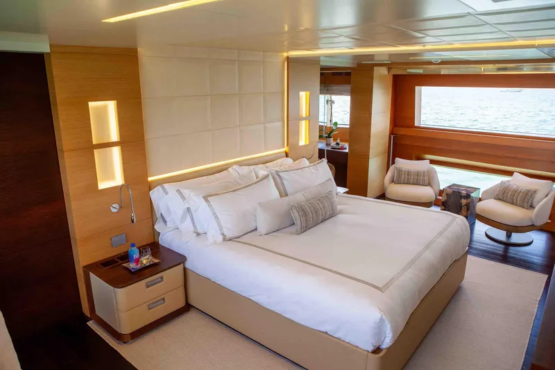 Slide: The Image of Luxurious bedroom interior on 2012 Benetti Classic Supreme 132 yacht, featuring elegant furnishings and ocean view. - 27