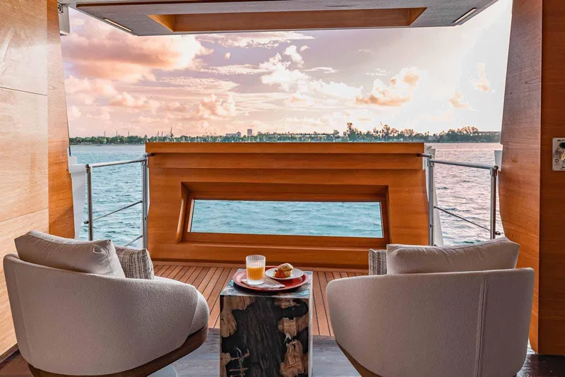 Slide: The Image of Luxurious Benetti Classic Supreme 132 yacht deck with ocean view, featuring elegant seating, 2012 model. - 29