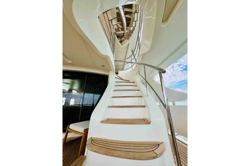 Slide: The Image of Elegant spiral staircase on 2012 Benetti Classic Supreme 132 yacht, featuring sleek design and wooden steps. - 38