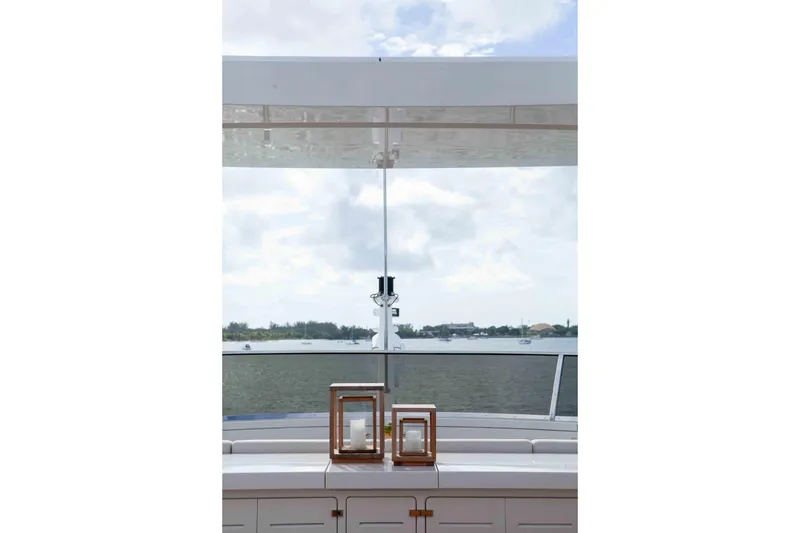 Slide: The Image of Luxurious Benetti Classic Supreme 132 yacht deck view, featuring elegant lanterns and serene waterscape. - 40