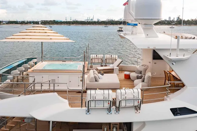 The Image of Luxurious 2012 Benetti Classic Supreme 132 yacht deck with jacuzzi and seating area. - 5