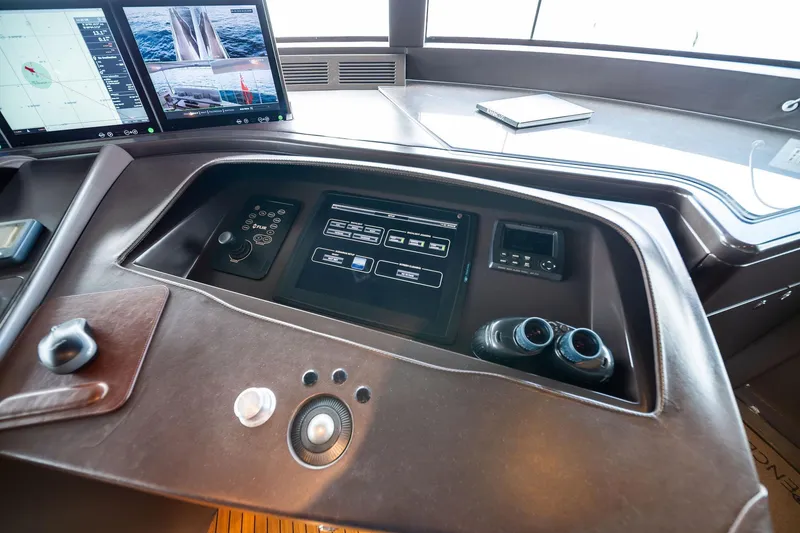 Slide: The Image of Control panel of a 2012 Benetti Classic Supreme 132 yacht with navigation screens. - 52