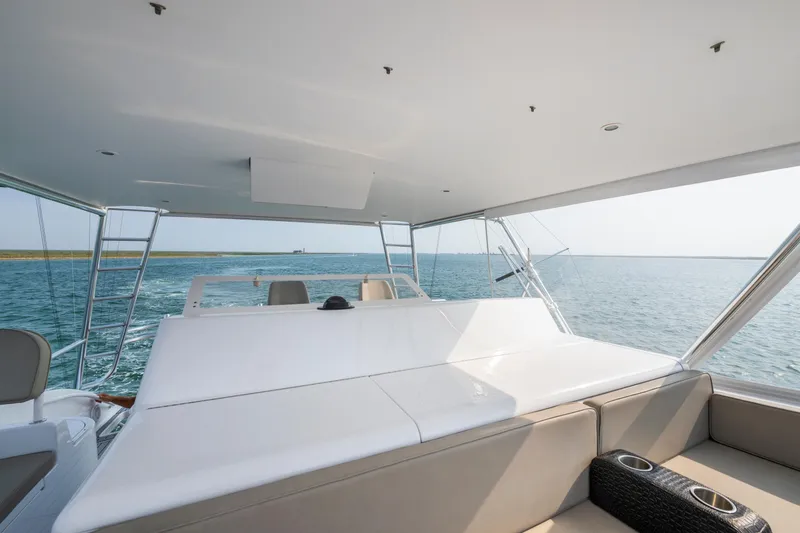 Slide: The Image of Luxurious 2005 Viking Convertible yacht interior with ocean view and comfortable seating. - 10