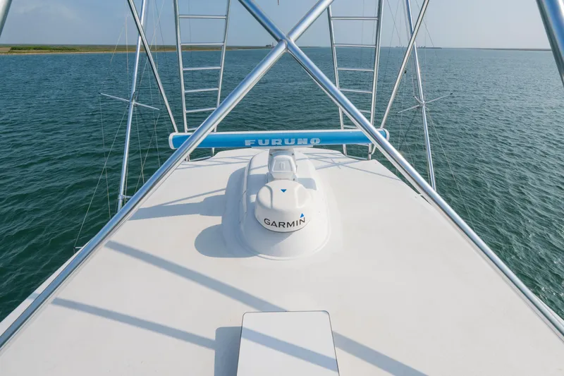 Slide: The Image of 2005 Viking Convertible boat with Garmin and Furuno equipment on open water. - 15