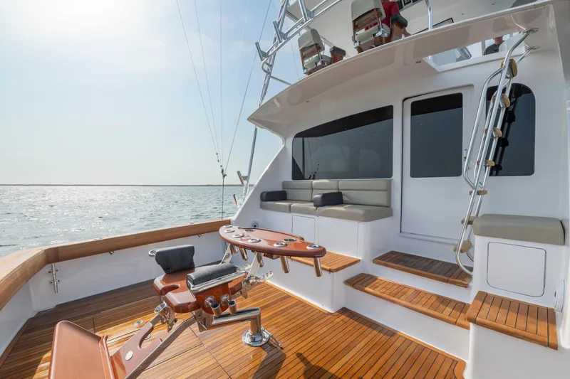 Slide: The Image of Luxurious 2005 Viking Convertible yacht deck with seating and ocean view. - 16