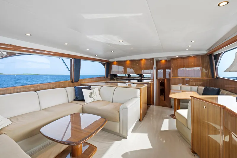 Slide: The Image of Luxurious interior of a 2005 Viking Convertible yacht with elegant wood finishes and ocean view. - 20