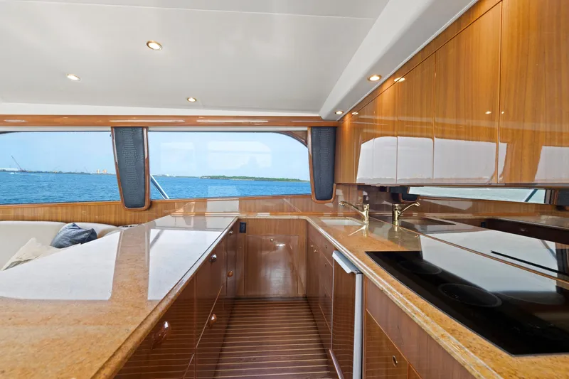 Slide: The Image of Luxurious 2005 Viking Convertible yacht interior with modern kitchen and ocean view. - 23