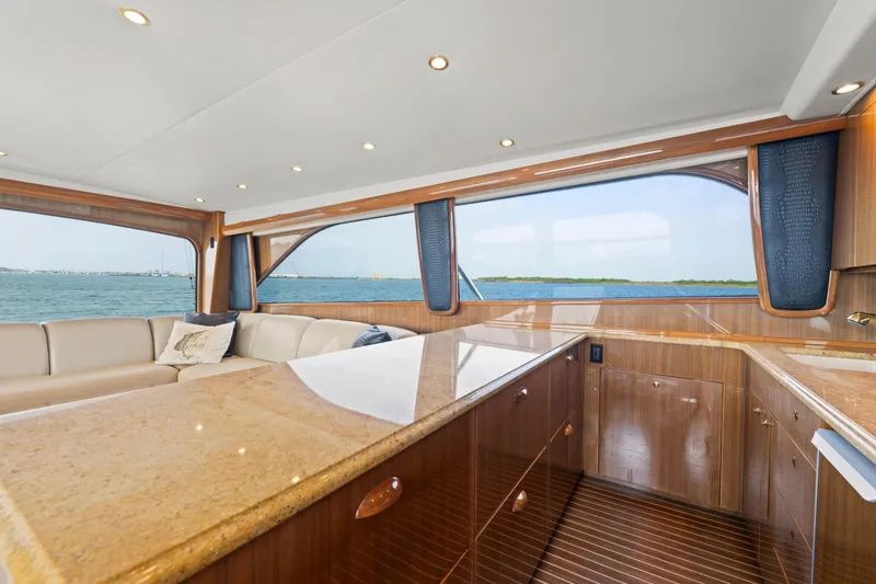 Slide: The Image of Luxurious interior of a 2005 Viking Convertible yacht with ocean view. - 24