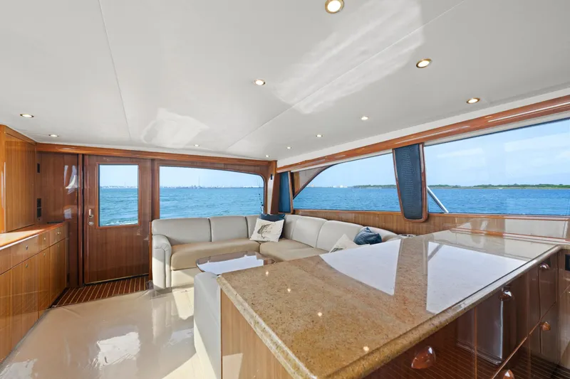 Slide: The Image of Luxurious interior of a 2005 Viking Convertible yacht with ocean view and elegant furnishings. - 25