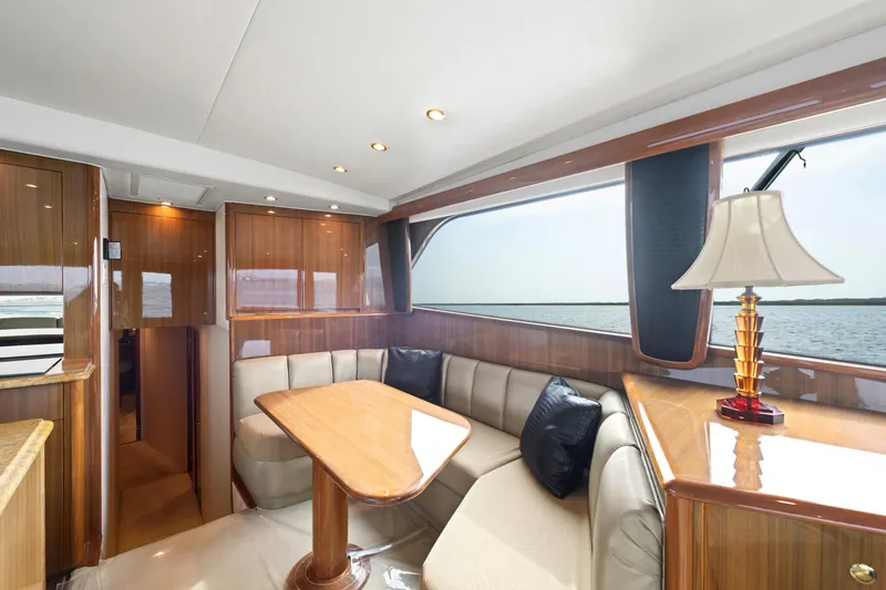 Slide: The Image of Luxurious interior of a 2005 Viking Convertible yacht with elegant wood finishes and ocean view. - 27