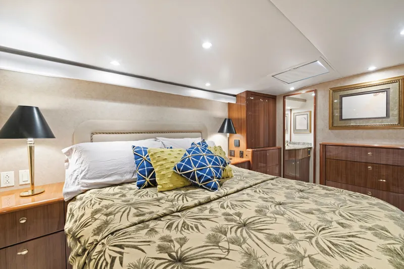 Slide: The Image of Luxurious bedroom interior of a 2005 Viking Convertible yacht with elegant decor and lighting. - 29