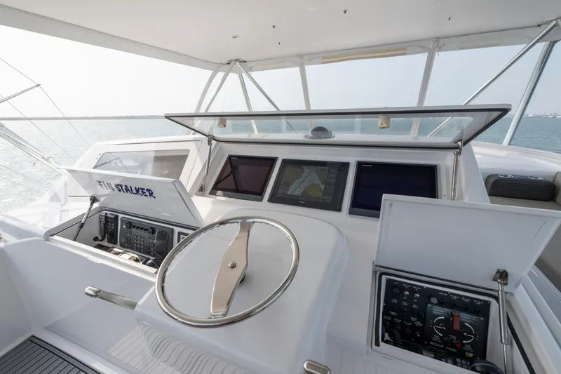 Slide: The Image of Helm of 2005 Viking Convertible yacht with navigation screens and controls. - 3