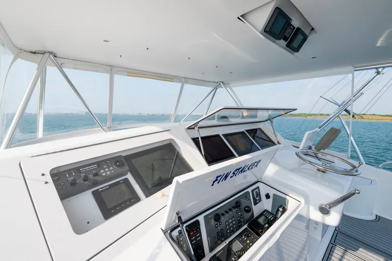 Slide: The Image of 2005 Viking Convertible yacht cockpit with advanced navigation systems and ocean view. - 4