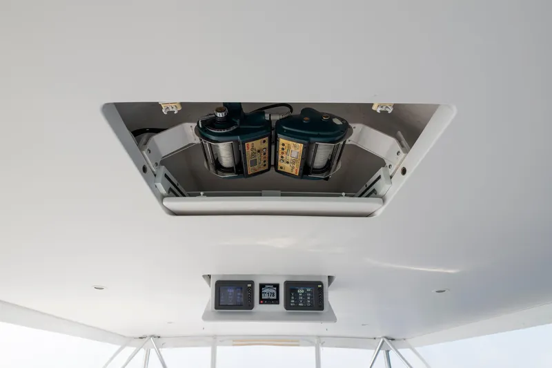 Slide: The Image of Ceiling view of 2005 Viking Convertible boat with electronic equipment and controls. - 7