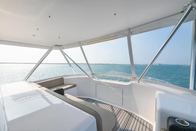 Slide: The Image of Luxurious 2005 Viking Convertible yacht interior with ocean view and sleek seating area. - 9
