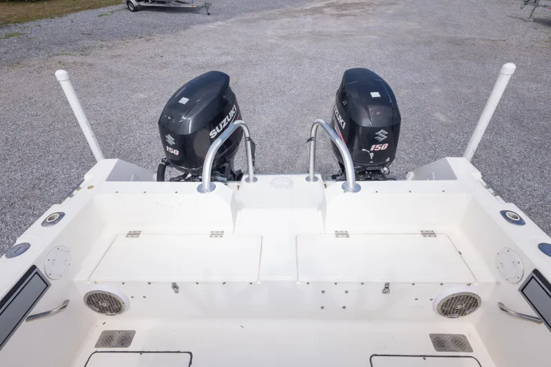 Slide: The Image of 1997 Sea Cat SL5 boat with dual Suzuki 150 outboard motors. - 19