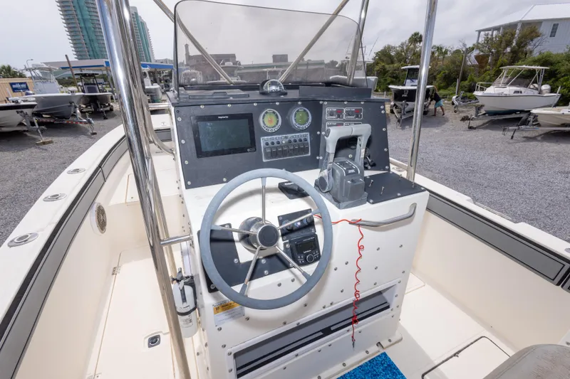 Slide: The Image of 1997 Sea Cat SL5 boat dashboard with steering wheel and control panel. - 21