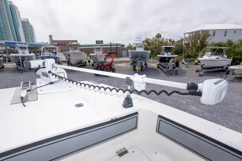 Slide: The Image of 1997 Sea Cat SL5 boat with trolling motor in a marina, surrounded by other boats. - 26