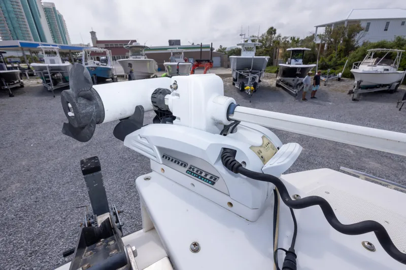 Slide: The Image of Minn Kota trolling motor on a 1997 Sea Cat SL5 boat in a marina. - 27