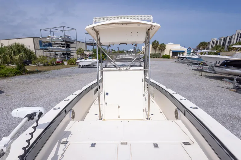 Slide: The Image of 1997 Sea Cat SL5 boat in a marina, featuring a spacious deck and T-top. - 5