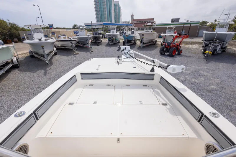 Slide: The Image of 1997 Sea Cat SL5 boat displayed in a marina with other vessels and equipment. - 9