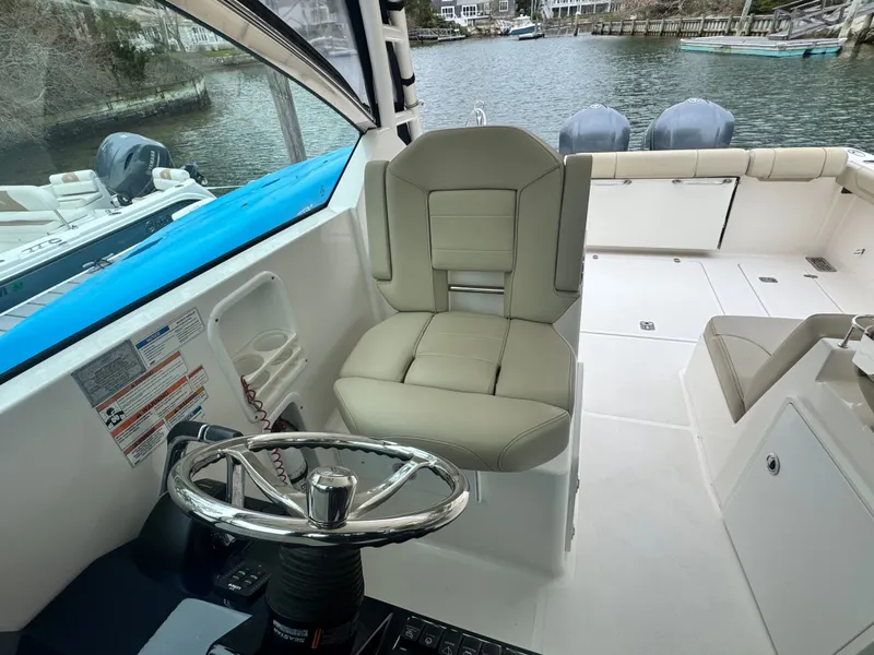 Slide: The Image of Interior of a 2017 Pursuit DC 295 Dual Console boat. - 10