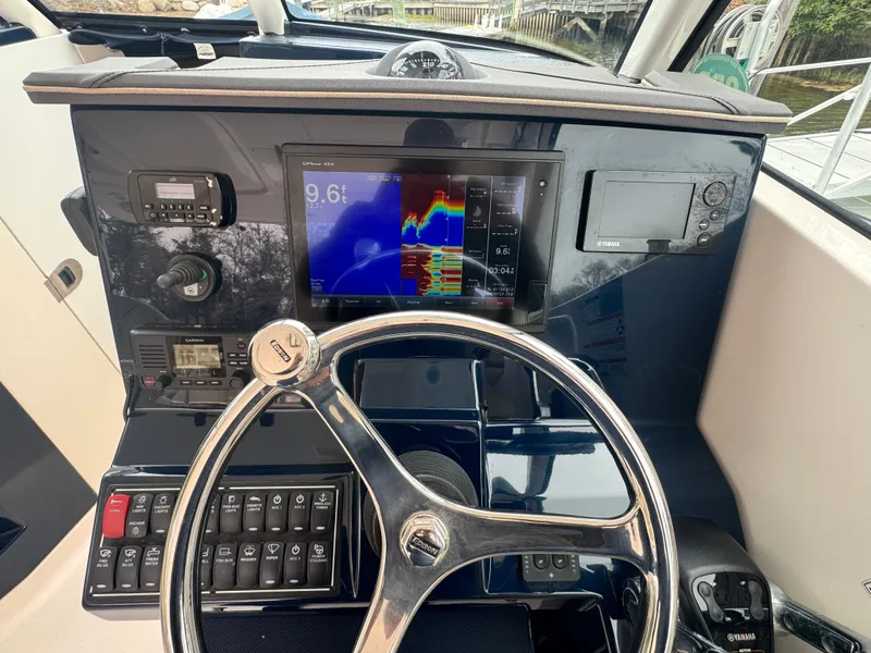 Slide: The Image of 2017 Pursuit DC 295 Dual Console helm with navigation system. - 11