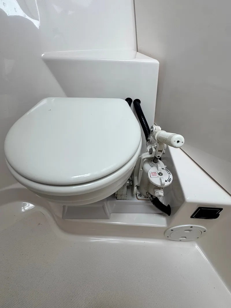 Slide: The Image of 2017 Pursuit DC 295 boat toilet with manual pump. - 12