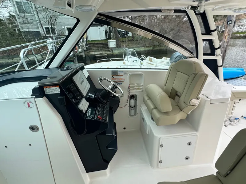 Slide: The Image of Interior of a 2017 Pursuit DC 295 Dual Console boat. - 18