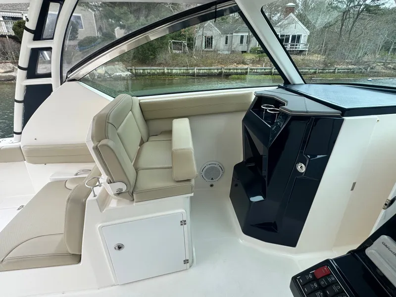 Slide: The Image of Interior of a 2017 Pursuit DC 295 Dual Console boat. - 19