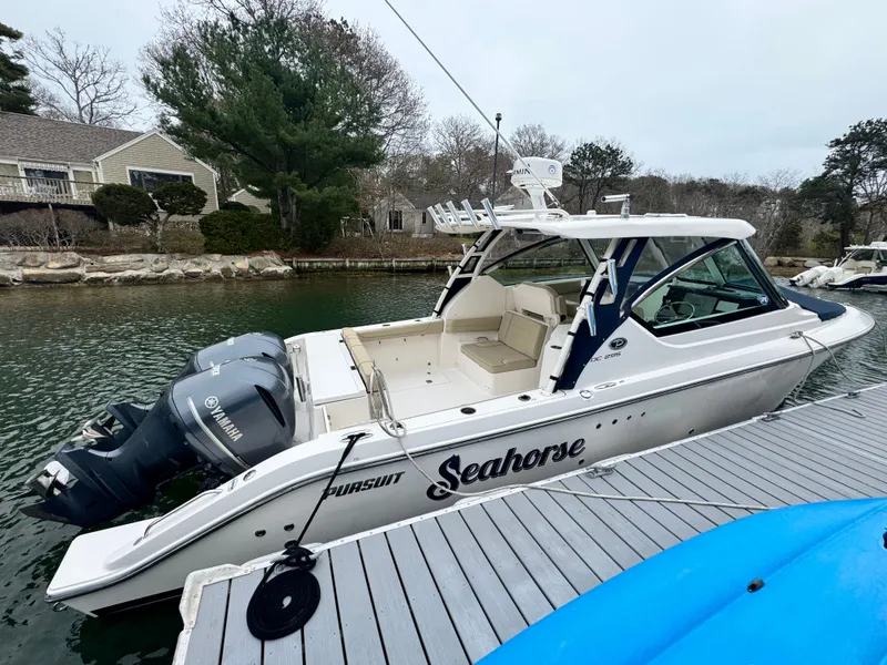 Slide: The Image of 2017 Pursuit DC 295 Dual Console boat at dock. - 21