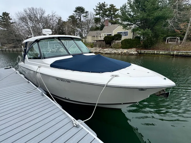 Slide: The Image of 2017 Pursuit DC 295 Dual Console boat docked. - 22