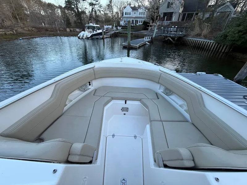 Slide: The Image of 2017 Pursuit DC 295 Dual Console boat at dock. - 23