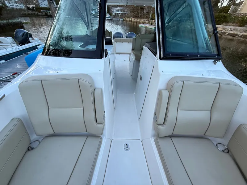 Slide: The Image of Interior view of a 2017 Pursuit DC 295 Dual Console boat. - 24