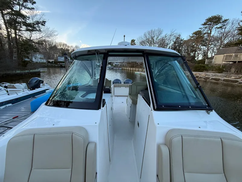 Slide: The Image of 2017 Pursuit DC 295 Dual Console boat at dock. - 25