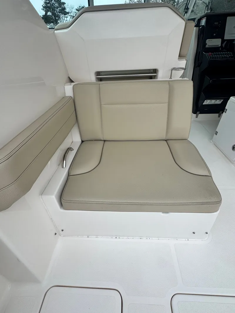 Slide: The Image of Seating area on a 2017 Pursuit DC 295 Dual Console boat. - 5