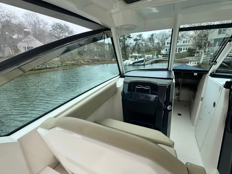 Slide: The Image of Interior view of a 2017 Pursuit DC 295 Dual Console boat. - 8