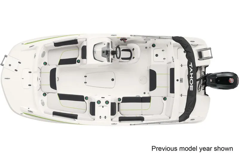 Slide: The Image of A 2022 Tahoe 1950 boat cruising under a bridge on a sunny day. - 2